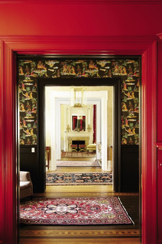 The view from the dining room to the formal living room crosses two anterooms and the foyer.
