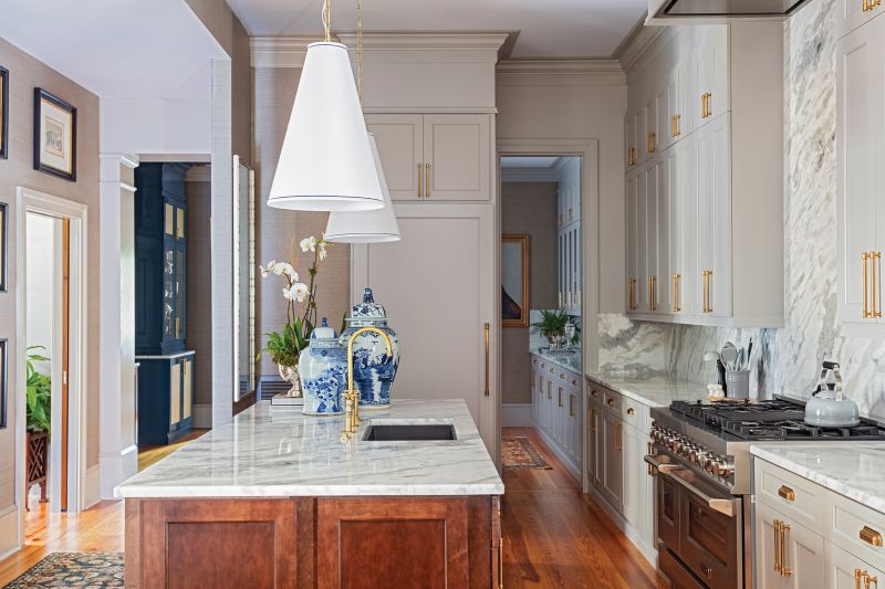 The couple chose Sumatra white quartzite from AGM Imports for the kitchen counters, island, and backsplash—all fabricated by Martol Marble & Granite.