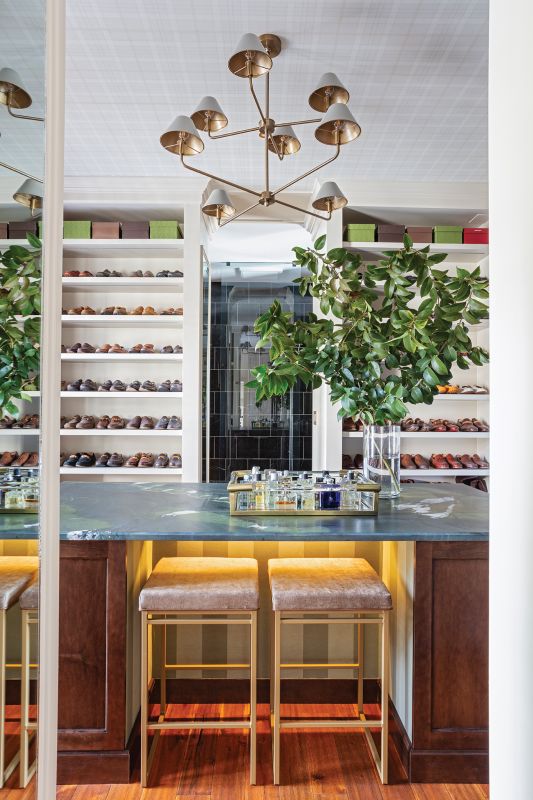Said closet resembles a high-end men’s store and stows everything from Will’s sunglass collection to luggage. “I’m very big into ‘everything in its place,’” John says.
