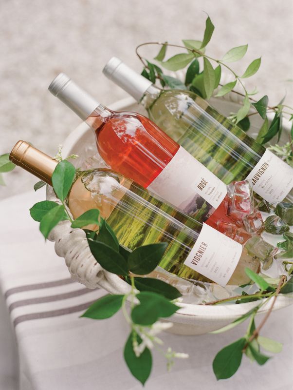 For the “bar,” Lynn filled a Vietri planter with ice and just-plucked jasmine vines to chill a variety of their Pippin Hill Farm & Vineyard wines.