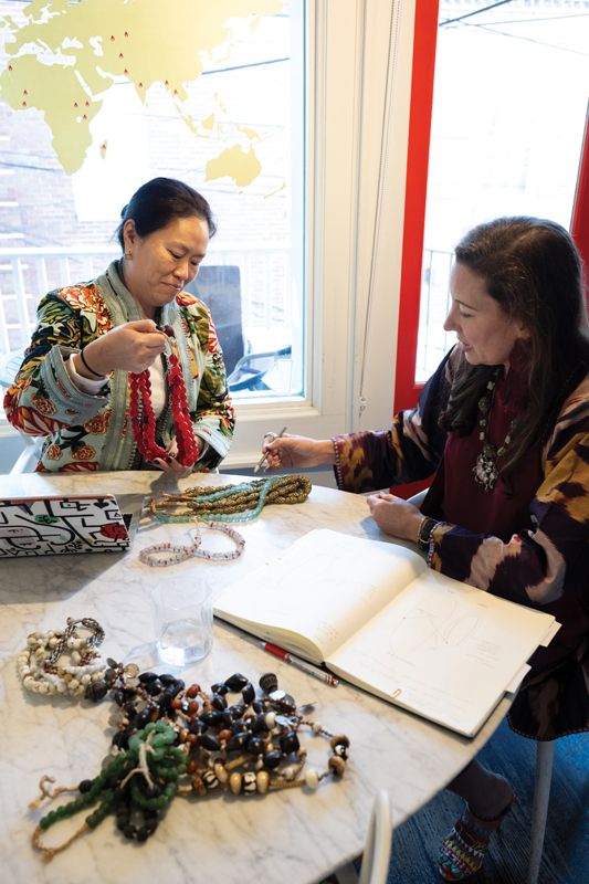 Designing Change: Ibu COO Beth Lin and Meredith Gale, director of creative collaborations, review product orders in the workroom.