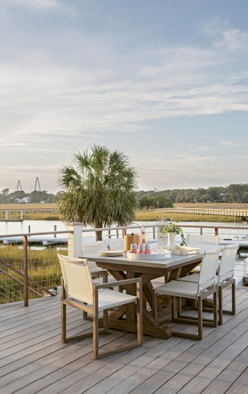 A weathered teak trestle dining table with concrete top and teak and mesh chairs, all from Restoration Hardware, promise to survive the elements while providing the perfect perch for soaking up vistas or enjoying cocktails and dinner with friends.