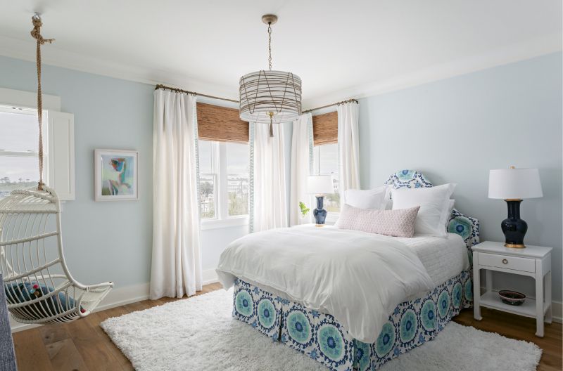The McElveens’ youngest daughter’s bedroom boasts eye-catching fabrics, from the custom-made bench in the Galbraith & Paul “Seville Tile” print in the master to the linen headboard with matching blue Quadrille bed skirt.