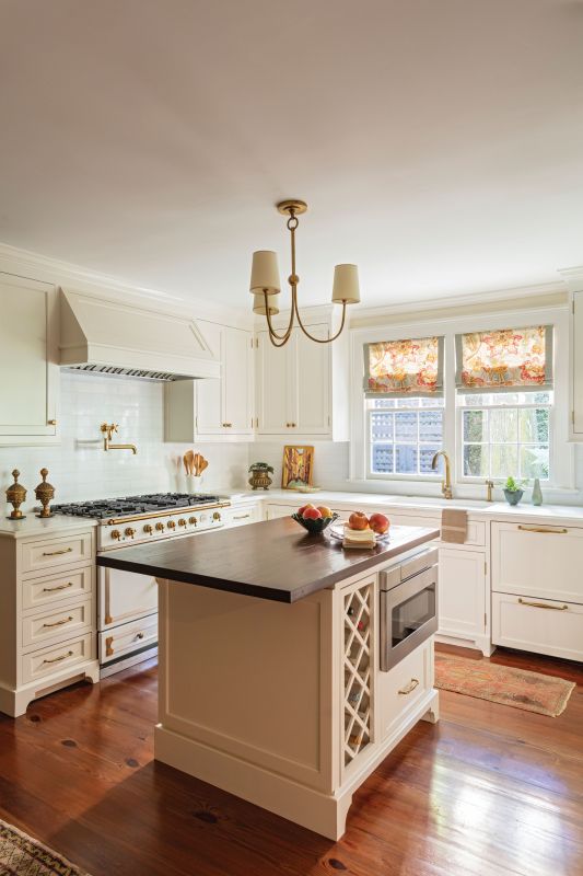 Light & Bright: The kitchen, situated in the home’s hyphen, is painted in Benjamin Moore “White Dove” and boasts a La Cornue range.
