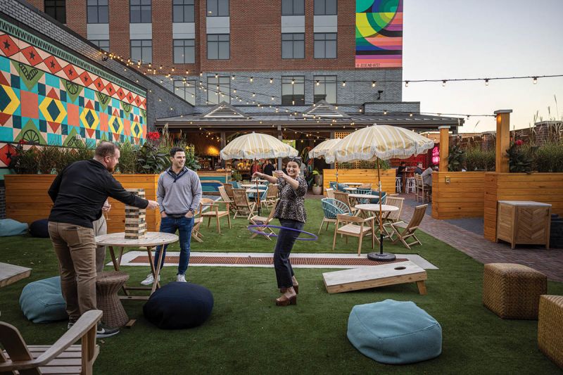 By the summer of 2024, the group had expanded into Northwest Arkansas, launching the laid-back tropical Bar Kapu in the Motto by Hilton Downtown Bentonville, alongside modern Japanese eatery Juntu Sushi.