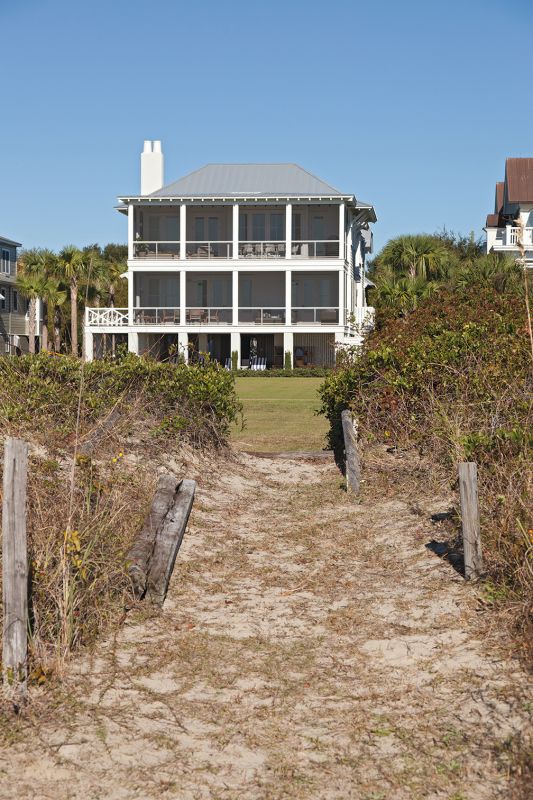 ...while the beachfront façade is a classic, porch-perfect beach house.