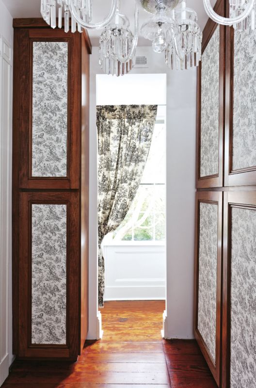 SENSING A PATTERN The pair covered cedar closet door panels in toile wallpaper.