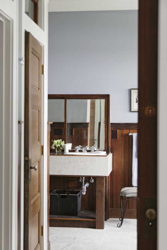 an old mercantile display case was refashioned into a vanity