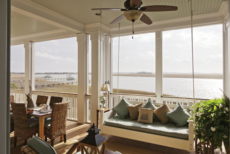 A Lowcountry Bed Swings daybed frames the Barbers’ view of the marsh