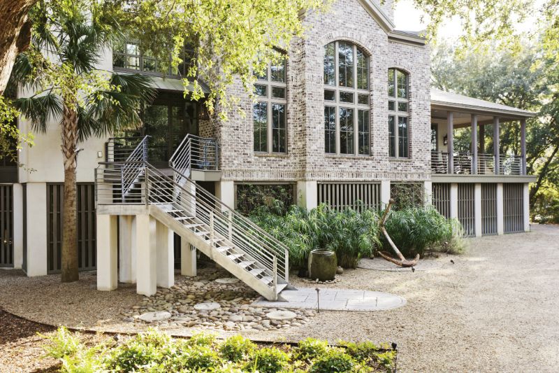 A vintage anchor lends patina to the home’s facade.