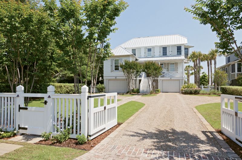 Front beach and center on Sullivan’s, this island home was built to mesh with old island ambiance, providing its owners a beautiful and easygoing retreat. Architect Beau Clowney, working with builders Daly & Sawyer, gave the street side of the house a smaller scale, in keeping with old Sullivan’s charm...