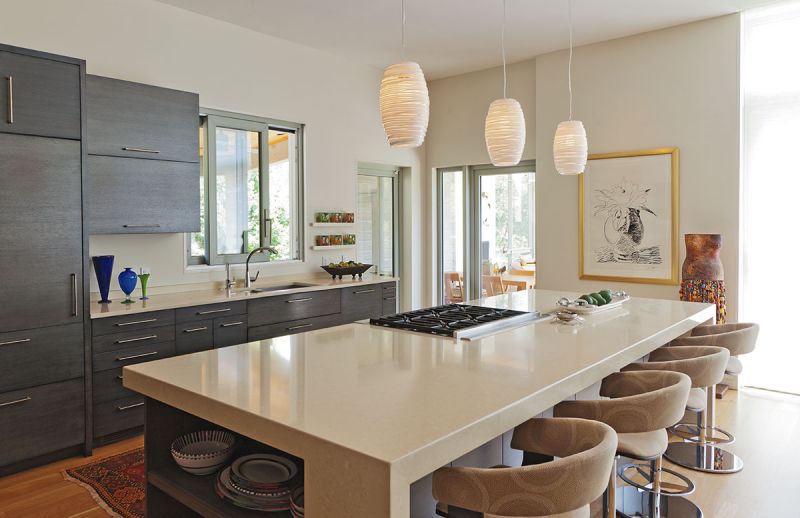 The addition encompasses an open living, dining, and kitchen space that fosters a loft-like feel.