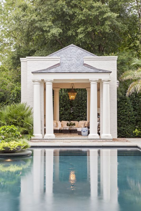 CABANA COOL: Elevated pool cabanas provide shade and a place to relax (top). A landscaped brick wall acts as a privacy screen as the Hastings boys face off in the pool for a game of chicken.