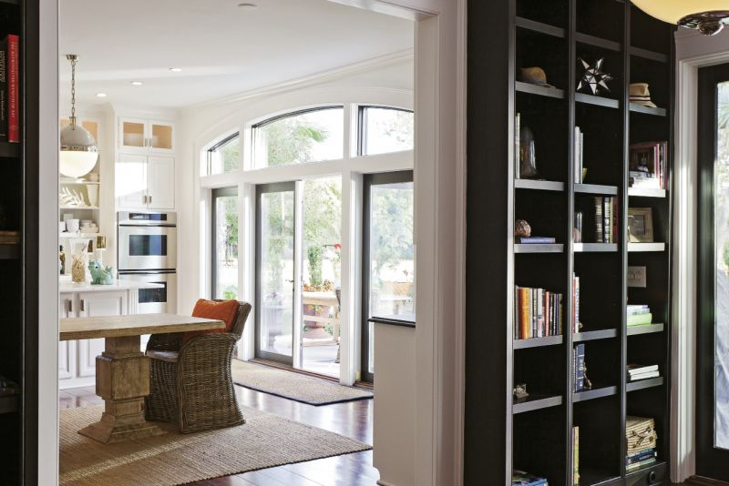 Sunny Chic: Oversize globe pendants from Circa Lighting, polished nickel hardware and lacquered cabinets.