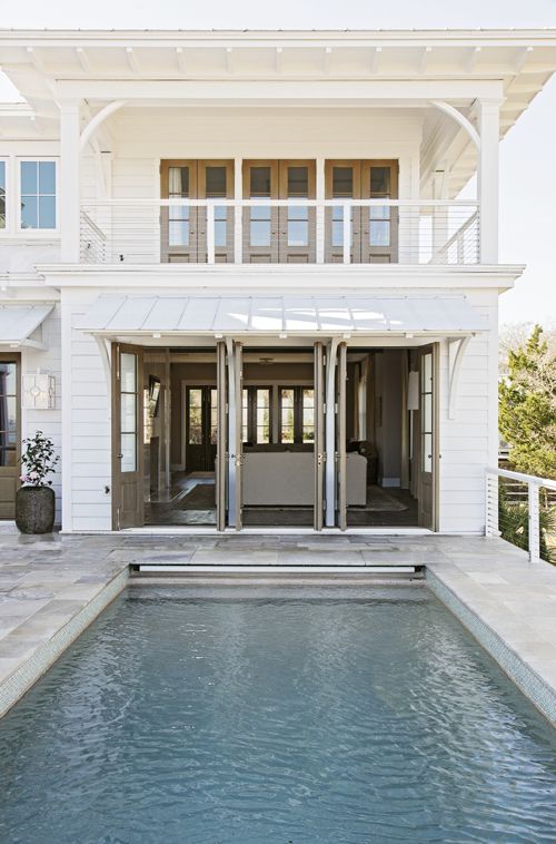 In the Swim: A wading pool graces one of four front porches; in the rear.