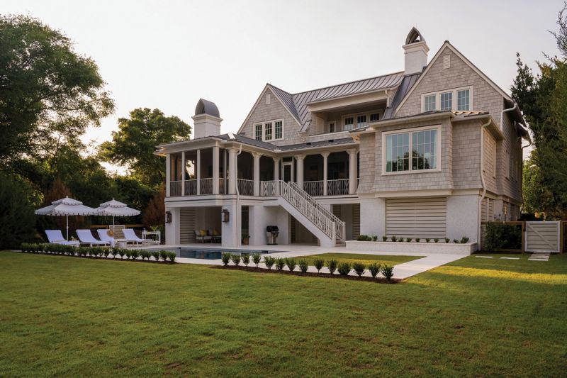 Island Life: Debby and Steele Alphin built this Atlantic Avenue beach house in 2021 as a place to spend their golden years. The main floor is a self-contained living area for the couple, while the upstairs provides plenty of room for their two daughters to visit with their families. Architect Amanda Orr managed to squeeze in an artist studio for Debby, whose paintings are sold through Atlanta Artist Collective and Serena & Lily. Ample outdoor living spaces, including a pool, large lawn, and screened porch, allow for a connection to the neighboring maritime forest and ocean beyond.