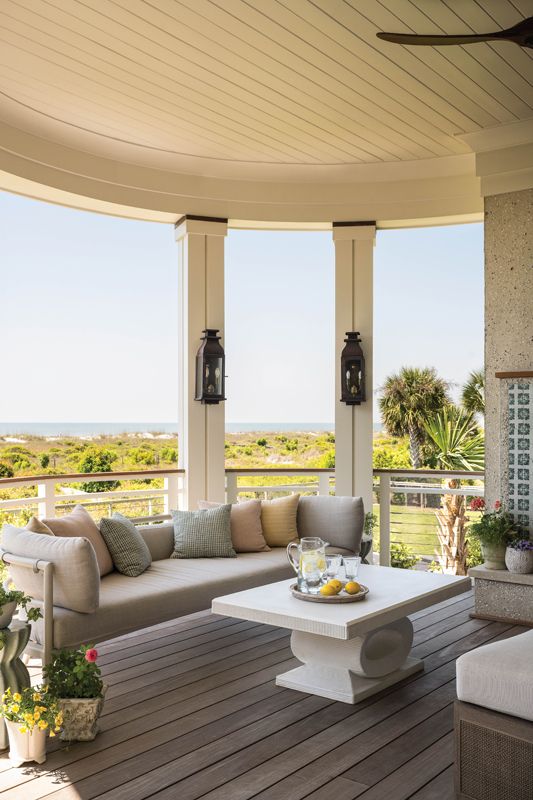 A cozy sitting area surrounds a fireplace decorated with Moroccan tile.