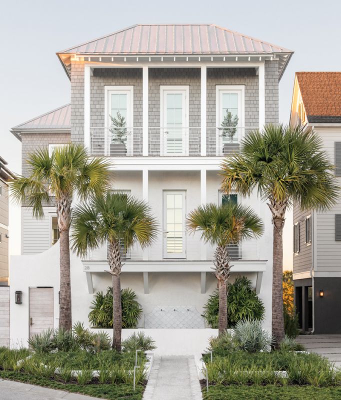Modern Moment: When Melissa and Brad built a house in Lowndes Pointe for the second time, they took architectural inspiration from the New Urban town of Alys Beach in Florida. A charming courtyard; lush, low maintenance foliage; and a fountain designed by Cindy Cline complete the modern, coastal aesthetic.