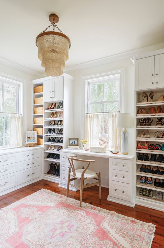 Organized Oasis: This small side room, designed by Inspired Closets, once functioned as a studio but had become a storage closet. “It was fun to take those spaces that had become a place to put junk and rethink them, creating a whole second closet for her,” says Elebash. Adding shelves and a built-in desk from Crate & Barrel turned this under-used space into a favorite spot for the homeowner. “I use it as my home office, too,” she says. “It really is a luxury