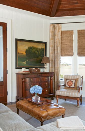 The handsome den with its vaulted wood-paneled ceiling