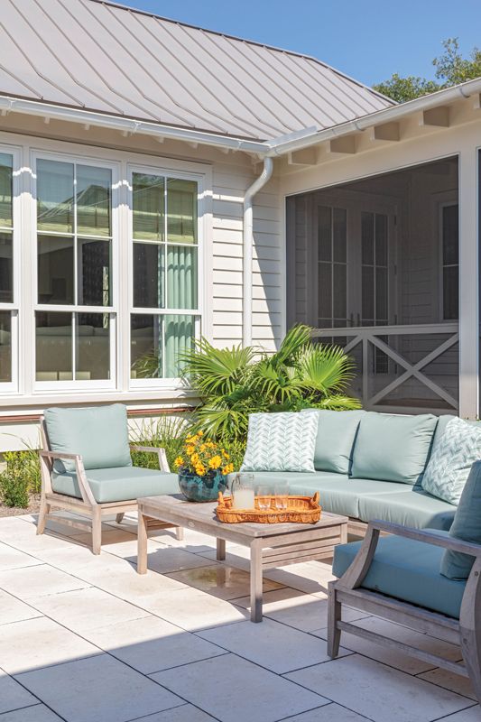 The deck leads to the dogtrot where the converted cobbler’s cottage now serves as a guest room/home office.