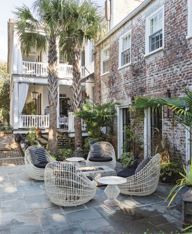 Sit a Spell: A spacious bluestone patio and luxurious Janus et Cie lounge chairs invite relaxation around the gas fire pit...