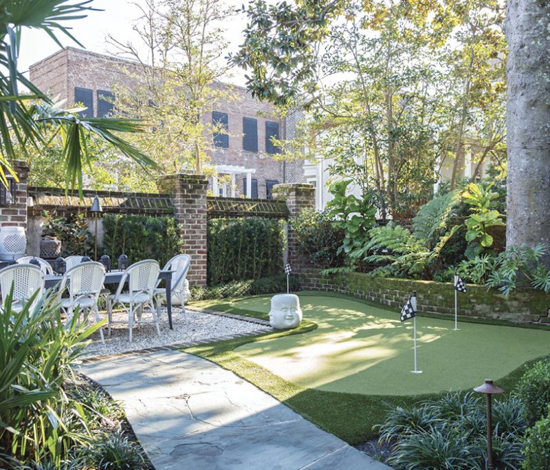 ...while the outdoor dining table overlooks a green, ideal for a little post-dinner putting.