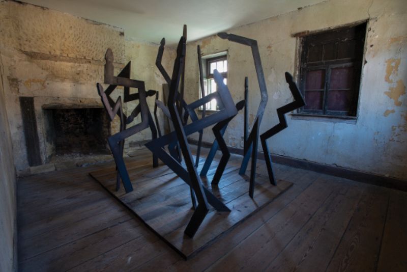 Local artist Fletcher Williams’s “Promiseland” included works on paper and sculptural installations at the house, like these fence pickets in the slave quarters arranged as if in a dance-like dialogue.