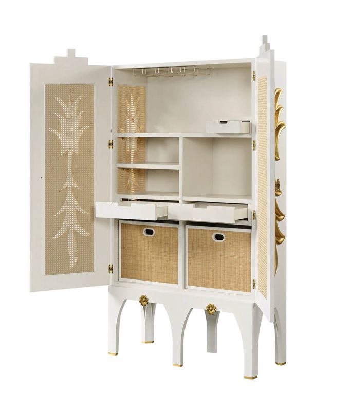 The “Francesca” wood bar cabinet in alabaster with rattan and gold details