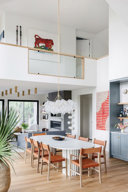 This created a large, open living space and the opportunity for a balcony where the couple showcase one of their favorite pieces, Tipu’s Tiger by Andrew Mockett.