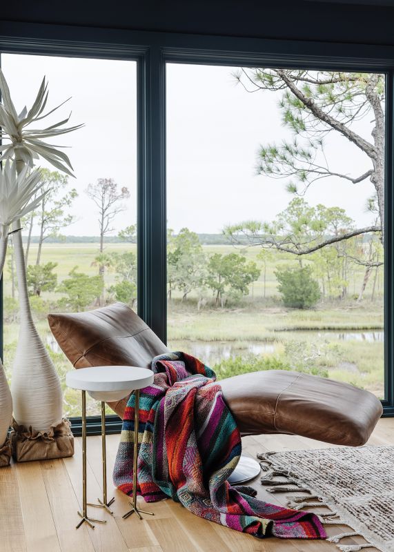 The upstairs includes three carefully curated rooms ideal for curling up with a book from the couple’s library and soaking up the view.
