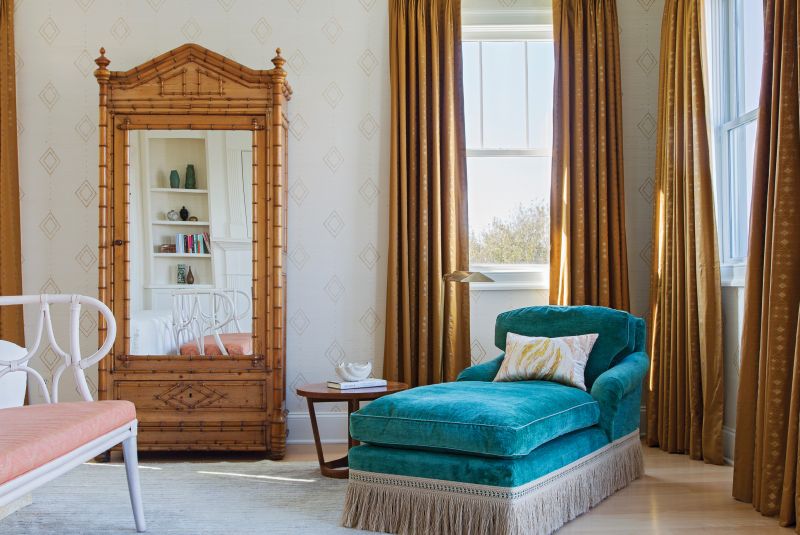 A faux bamboo wardrobe from Fritz Porter, custom drapes in a Muriel Brandolini fabric from Holland & Sherry, and vintage chaise in Pierre Frey velvet add a touch of Hollywood flair and elegant romance.