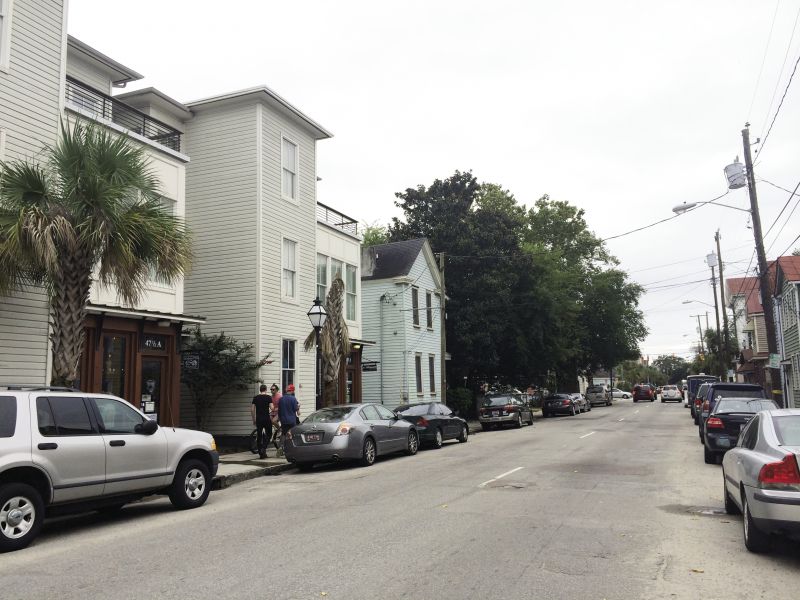 With a growing population on the peninsula, developers are replacing dilapidated housing (as above on Spring Street) with mixed-use buildings, raising gentrification concerns.