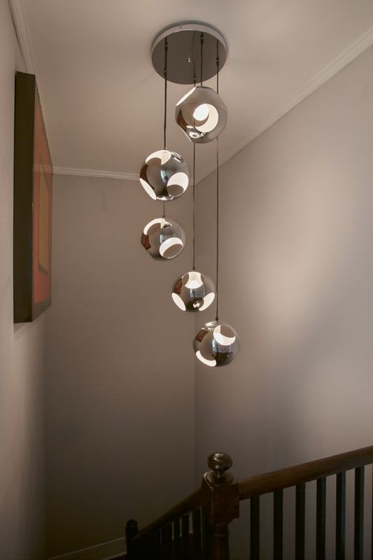 Naylor found the chandelier that illuminates the stairwell on eBay.