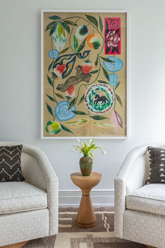 Kim Salmela Atelier “Benson” swivel chairs in “Tilly Sand” linen flank a Pinch “Float” table beneath Laura Burke’s Summer print from Tappan.