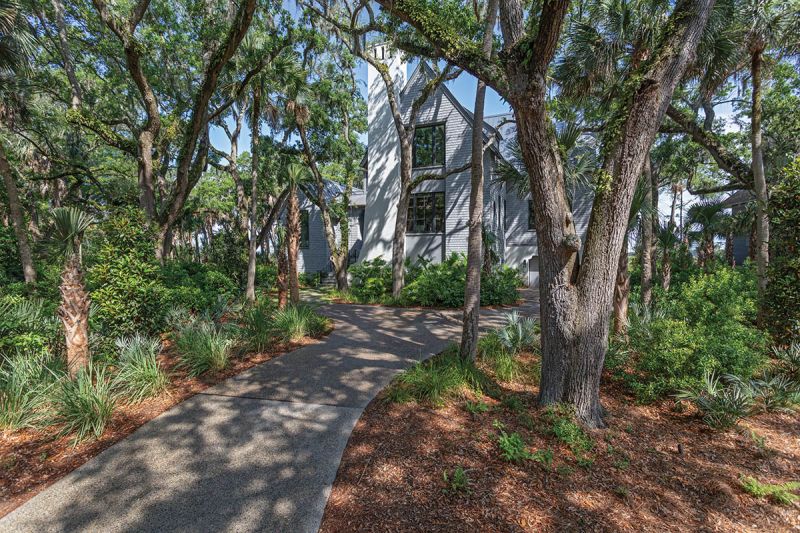 The densely wooded lot posed a challenge that Cumulus Architecture & Design overcame by fitting the home in the spaces between, creating a tree house-like feel and softening the volume of the 5,500-square-foot home.