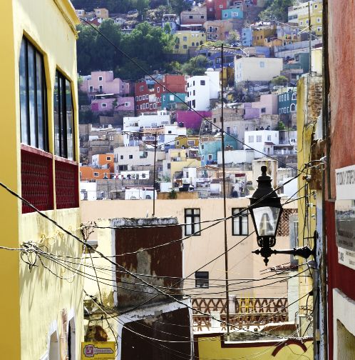 A view to residential neighborhoods that cover the hillside and valley
