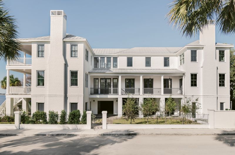 When viewed from the side, the home seems to morph into something more modern. “We call it traditional up front, party in the back,” jokes interior designer Cortney Bishop.