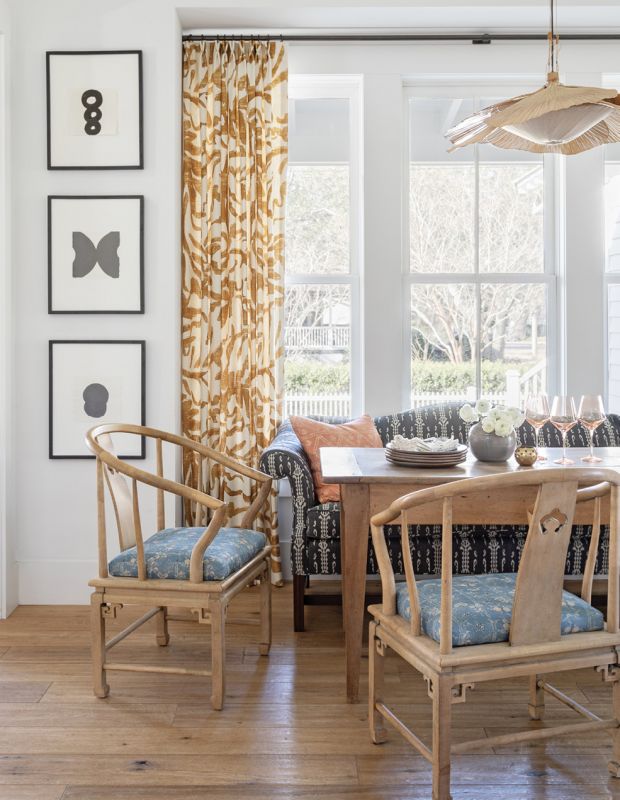 Curtains fabricated in Zak+Fox “Sauvage” linen added interest to the adjoining dining area. Other fabric changes—giving a favorite settee a fresh new look courtesy of C&C Milano and the Robert Kime floral (sourced at Charleston’s Fritz Porter) on the chairs—instantly transformed the space. The vintage “Uchiwa Hana” chandelier by Ingo Maurer completes the beachy boho look.