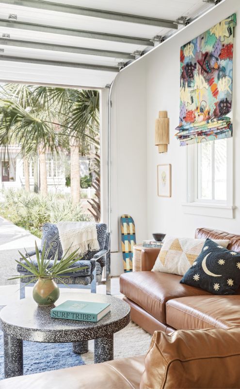 Teen Scene: Stone and leather (in the form of a terrazzo coffee table from Anthropologie and sofa from West Elm) are durable yet great-looking choices for the garage-turned-kids’ hang space.