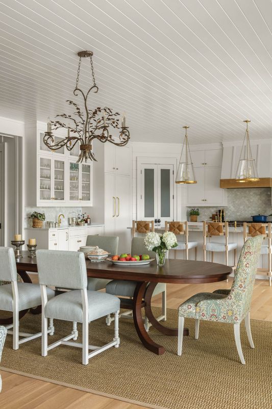 Brad Nietert of Nietert Antique Restorations hand-planed oak to craft this dining table with a pedestal base that feels both current and timeless. Chaddock chairs are upholstered in linens by Colefax and Fowler and Le Gracieux.