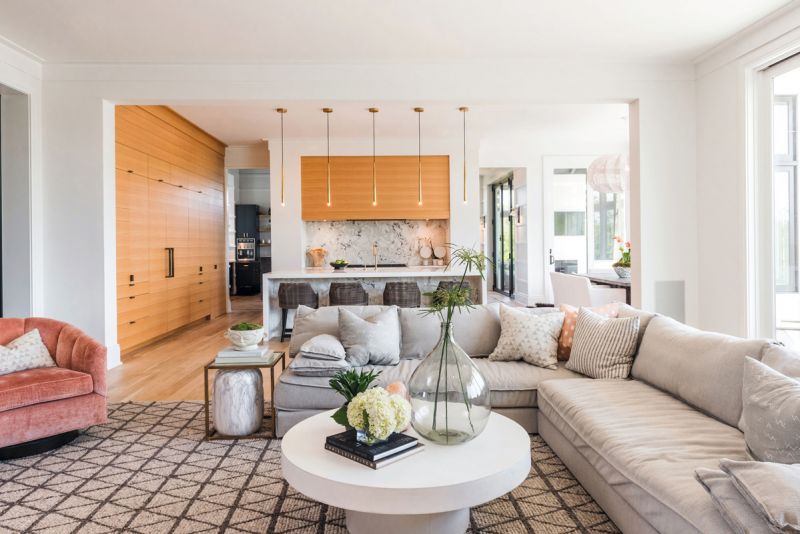White oak built-ins match the open-concept kitchen’s custom cabinetry.