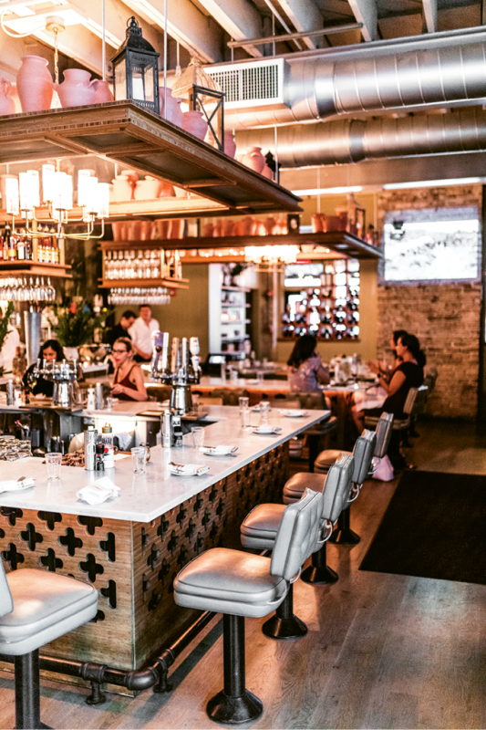 GOLDEN HOUR: Guests can take a seat at the charming candle-lit counters or venture out to the patio terrace.