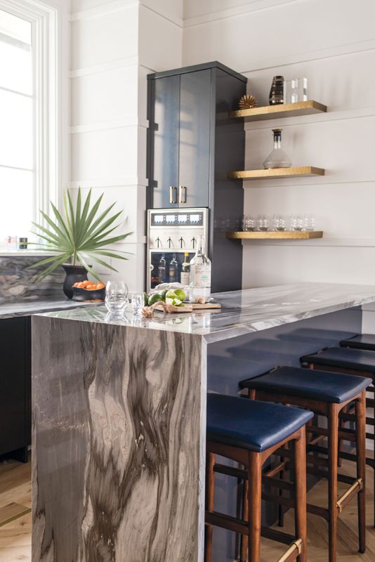 Beverages are at the ready in the adjacent poolroom and its bar with a self-serve wine dispenser.