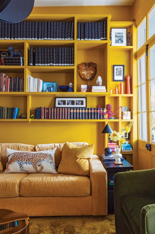 The sunny upstairs den is drenched in “Crispy Gold” by Sherwin-Williams.