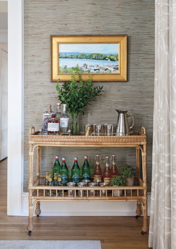A Serena & Lily bar cart anchors a painting by Michigan artist Richard Kooyman.