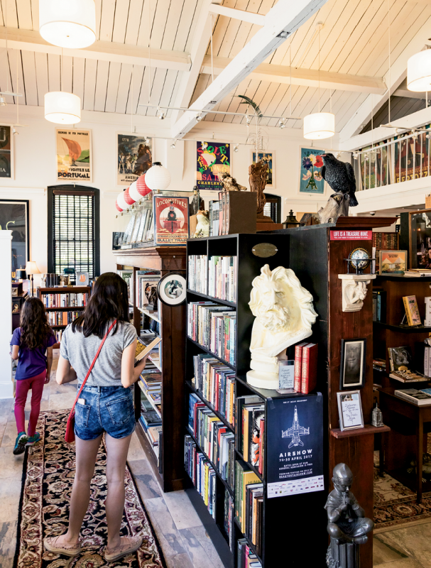 Perusing the titles at NeverMore Books on Craven Street, a collection focused on fiction and first editions, as well as displays of art and sculpture