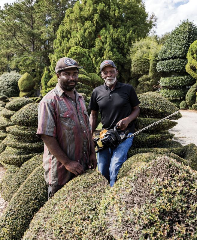 Helping Hand: “One thing about life: no matter who you are, one day Old Man Time will slow you down,” says Fryar, who will turn 80 in December. He’s pictured here with his longtime assistant, Michael Baker.