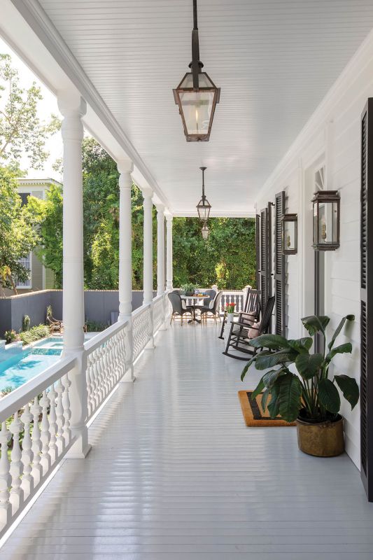 he piazza floor features the understated Colors of Historic Charleston “Antique Pewter.” The new addition, distinct from the original building with different exterior siding and red roofs, reinforces the home’s layered story. The project earned a Carolopolis Exterior Award from the Preservation Society of Charleston in February.