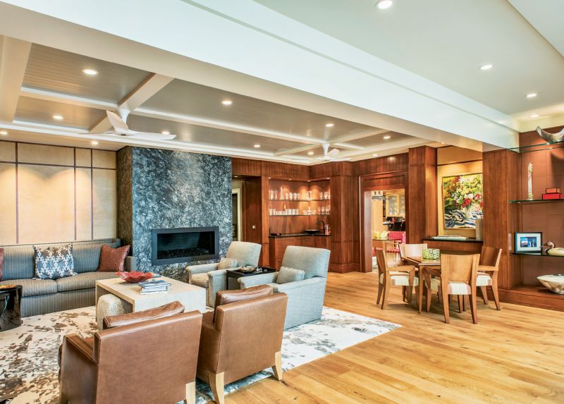 Leather panels add warmth and texture on the walls, and two sitting areas accommodate cozy conversations or big parties.